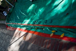 Close up of step to first aid tent at Occupy LA, with signage that says "step up step down"